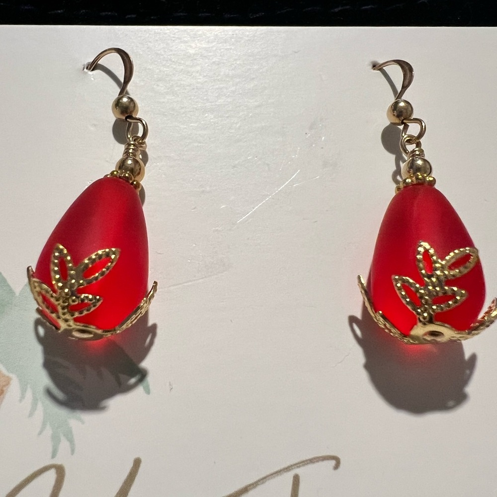Red sea glass earrings with gold tone hardware .  Brand new